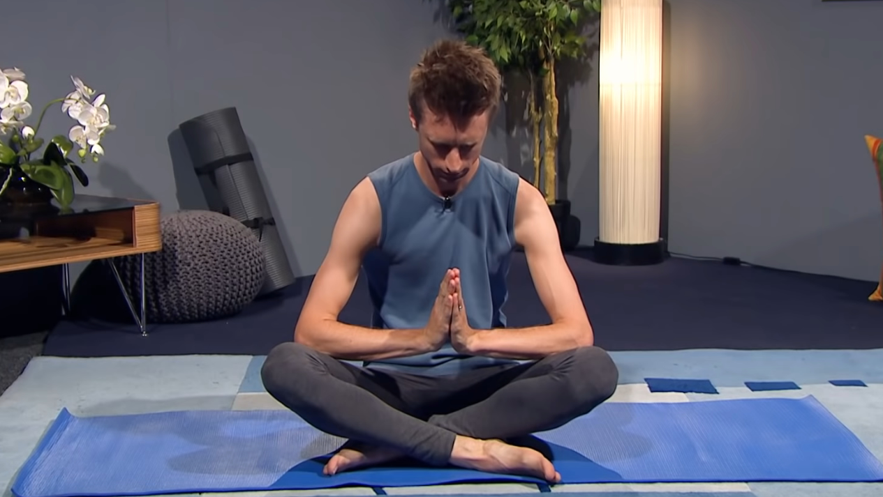 Brexit yoga with teacher in praying position